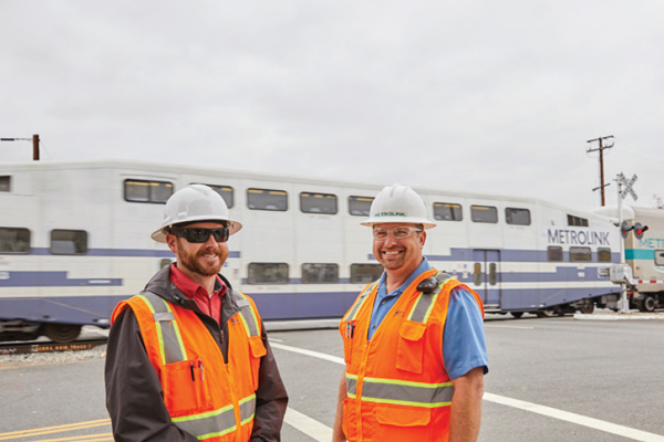 Metrolink employees wearing hard-hat safety gear 